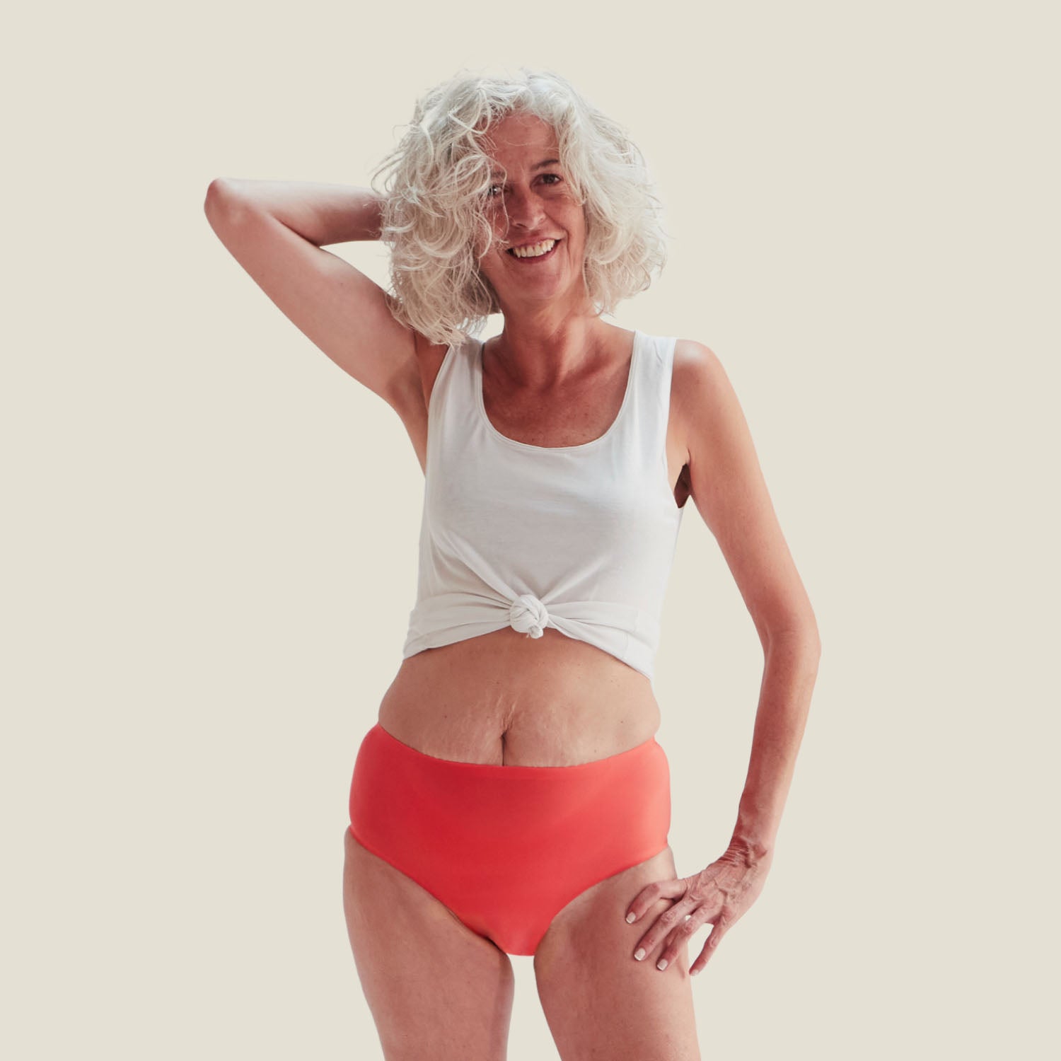 WUKA Drytech™ Incontinence Midi Brief in Coral Pink shown in full-length front view, designed for light leaks with a smooth, high-waist fit that offers comfort and discretion.