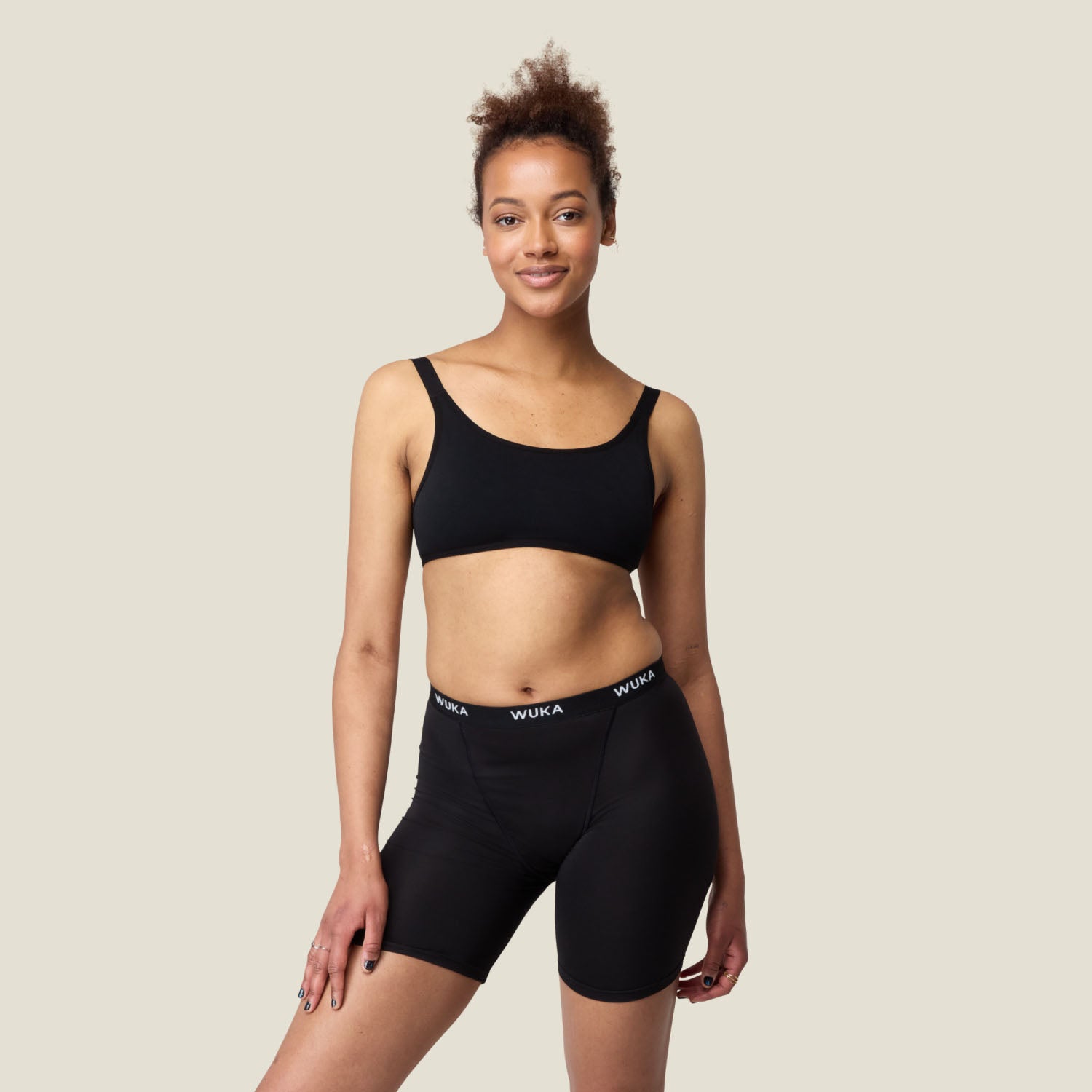 Front view of a model wearing WUKA Ultimate™ Boxer Shorts for heavy flow, designed for full coverage and maximum period protection.