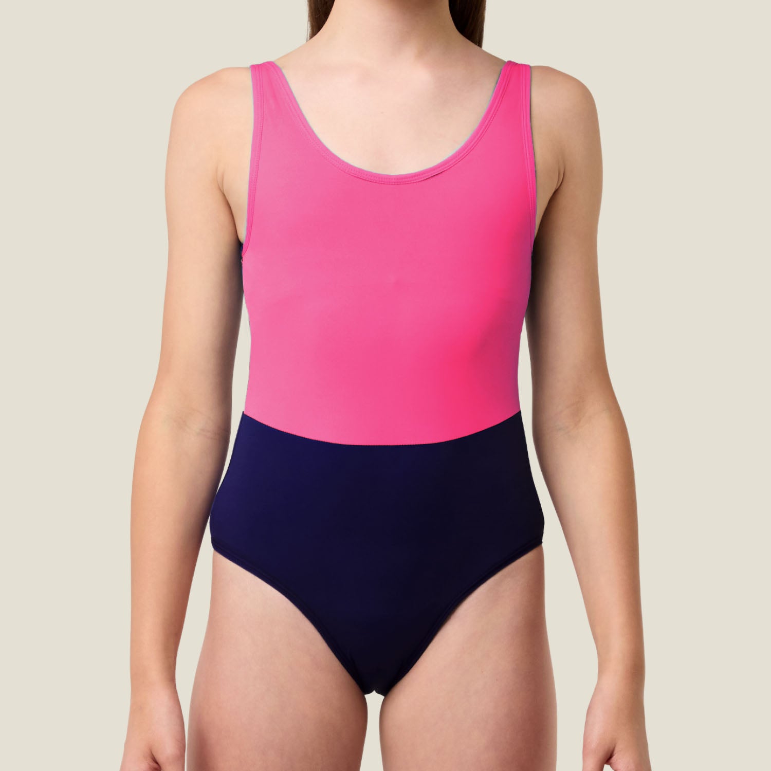Close‑up of WUKA Teen Two‑Tone Period Swimsuit showing smooth pink upper and purple lower — secure swimwear for medium flow.