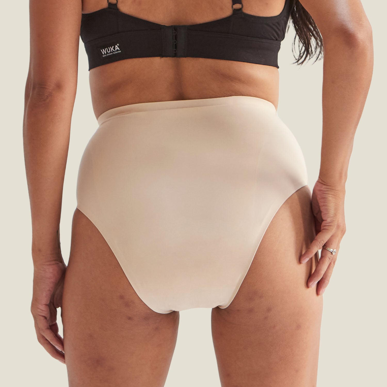 Back view of WUKA Drytech™ Incontinence Midi Brief in Light Nude, showing seamless design for all-day comfort.