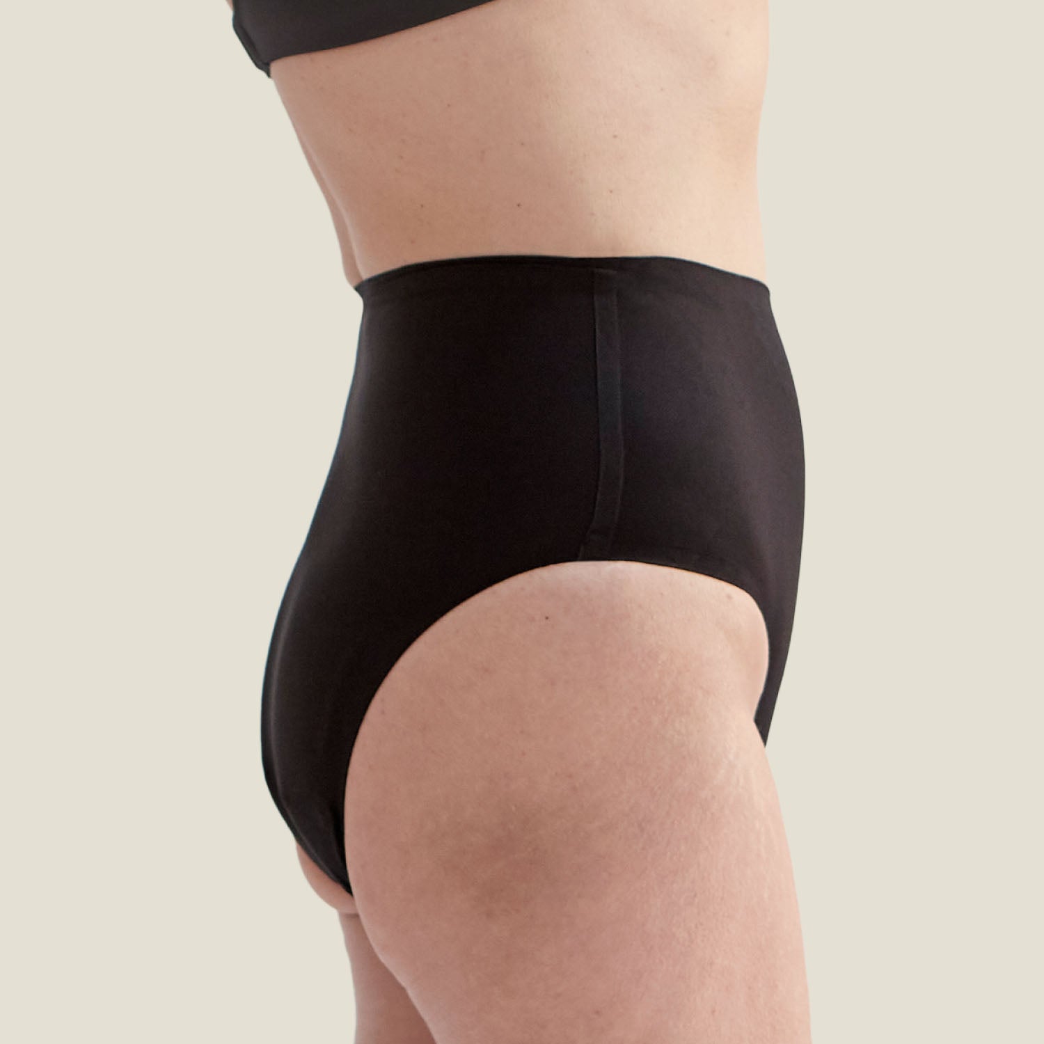 Side profile of the Drytech™ High Waist Incontinence Brief in black, featuring a sleek design ideal for everyday wear and leak protection.