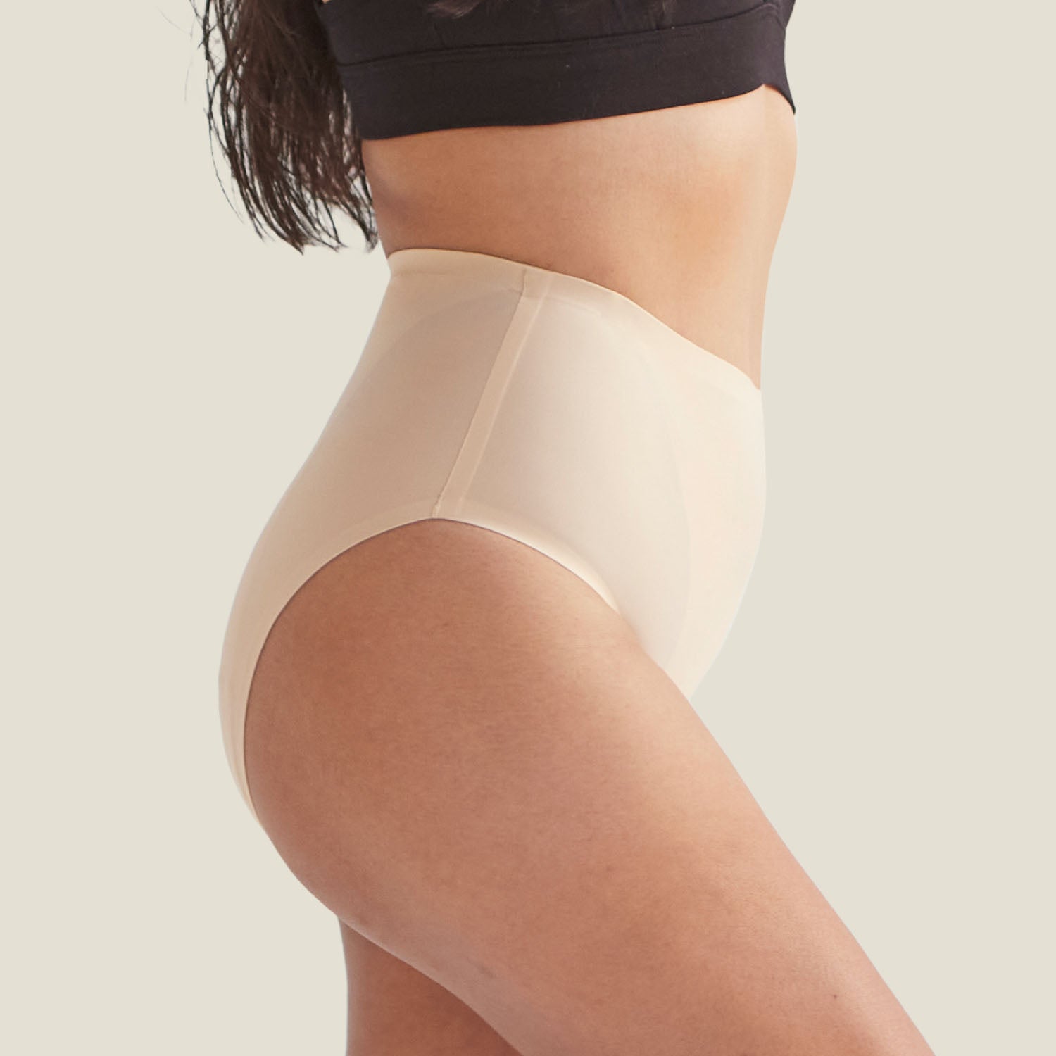 Side profile of WUKA Drytech™ Midi Brief in Light Nude, highlighting soft stretch fabric for a secure, leak-proof fit.