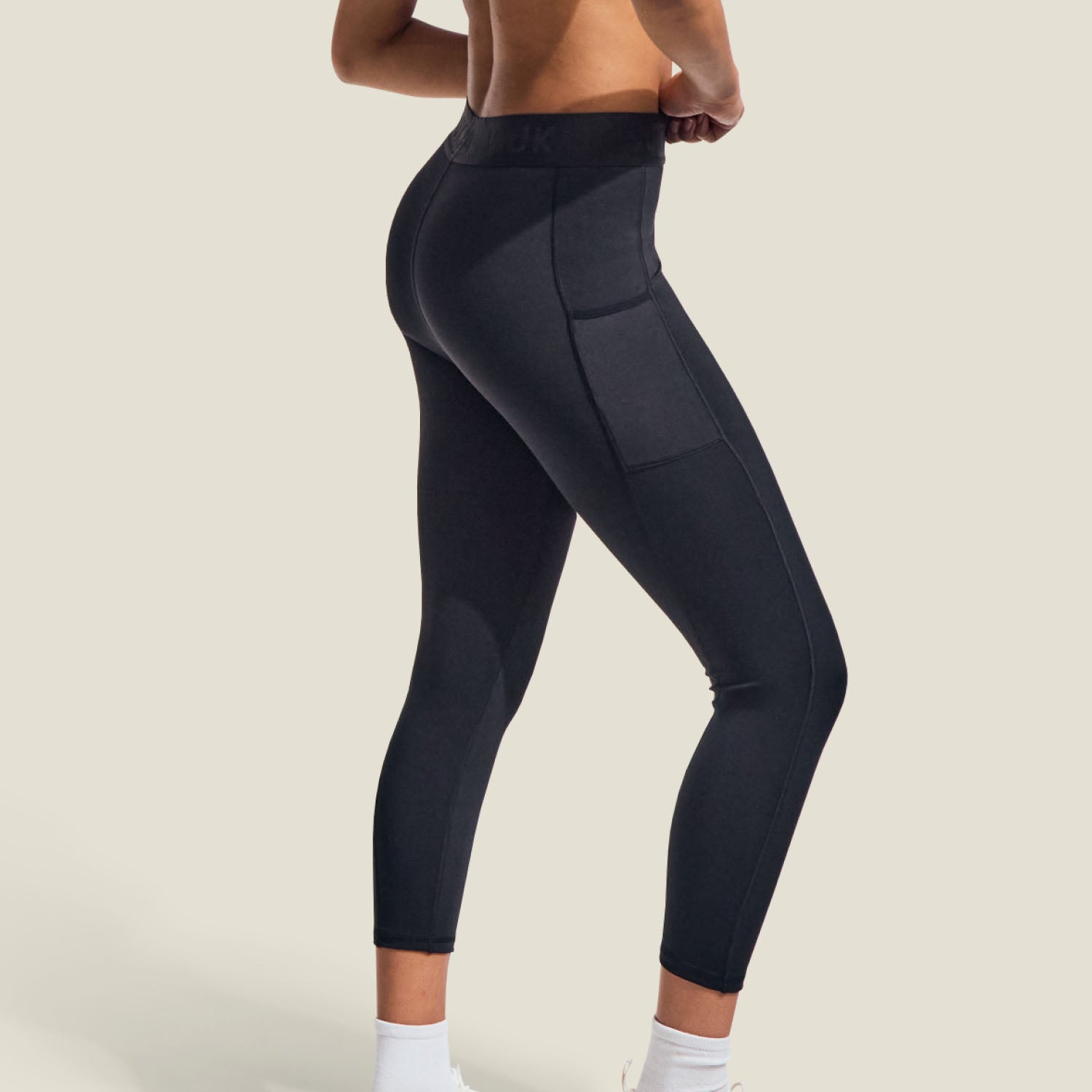 Side view of WUKA Period Leggings with visible side pocket, breathable stretch fabric, and leak-proof gusset for medium flow.
