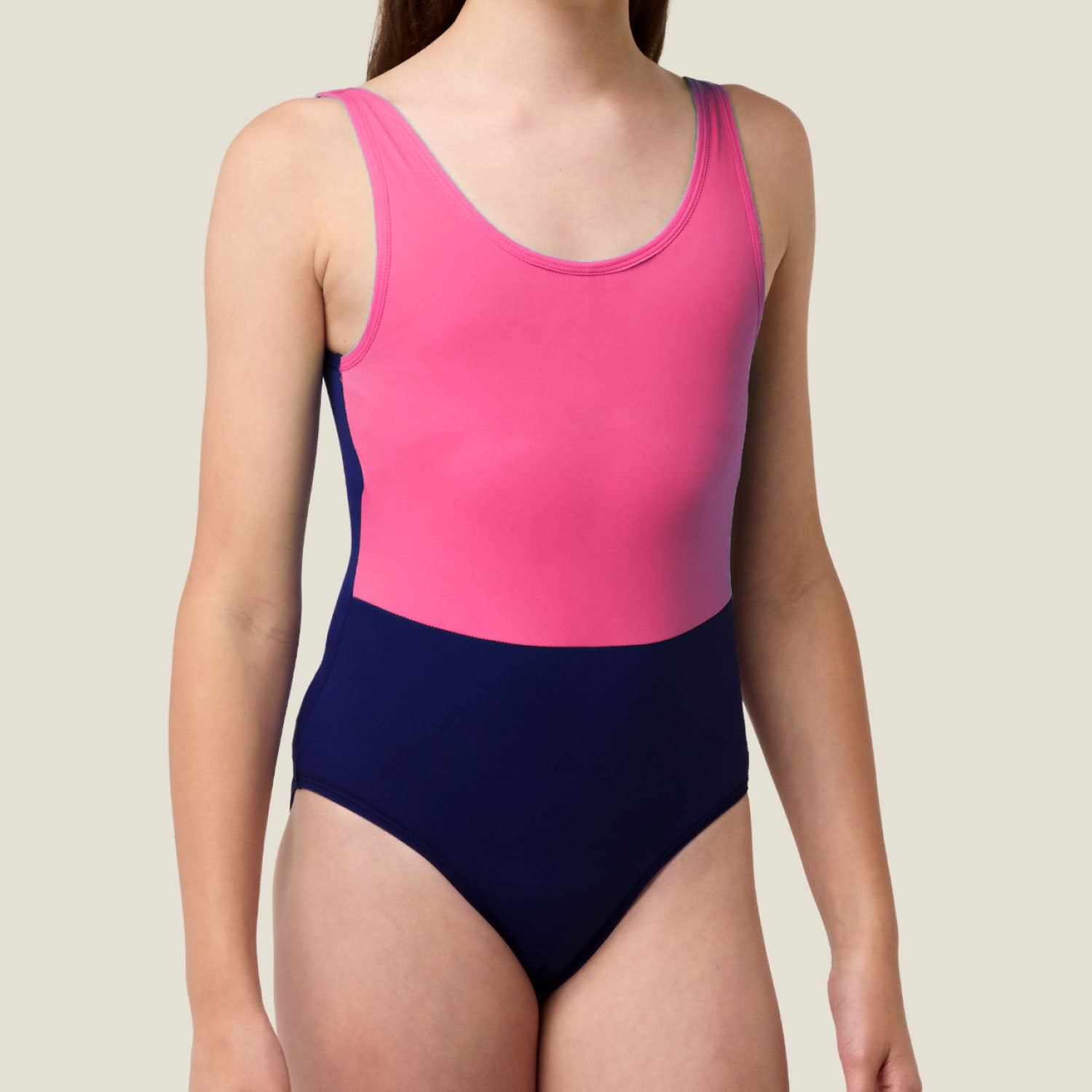 Side angle of WUKA Teen Period Scoopback Swimsuit (pink/purple) — streamlined one‑piece made for movement and confidence.