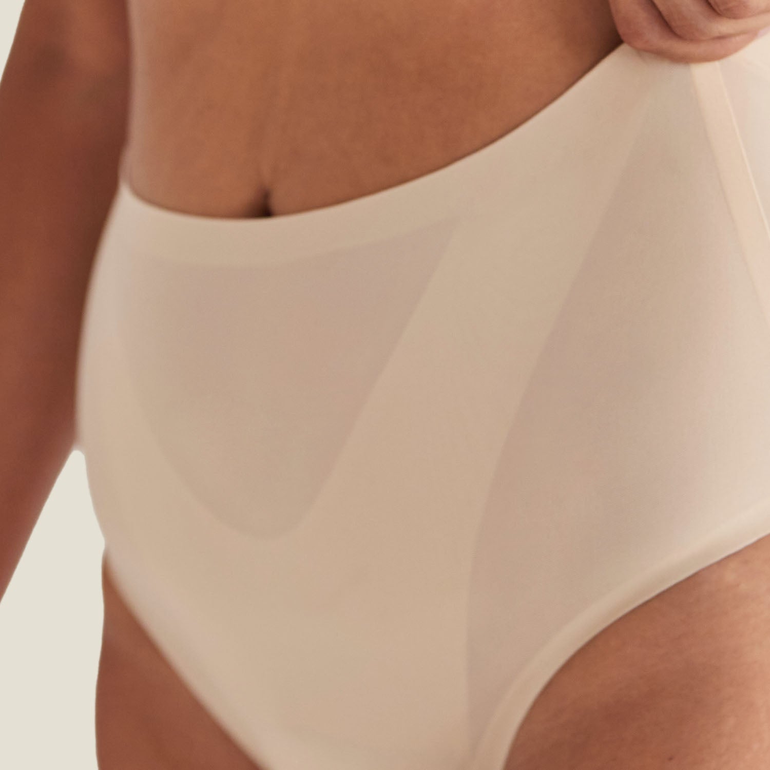Zoomed-in view of WUKA Drytech™ Midi Brief stretch fabric in Light Nude, offering flexibility and soft fit.