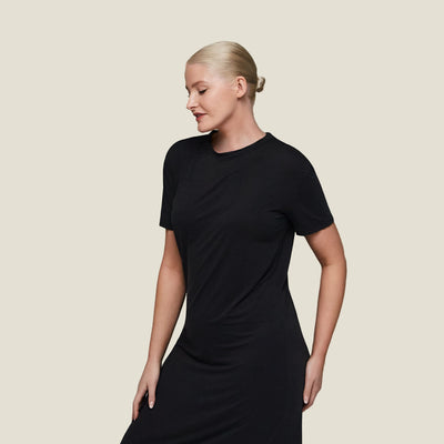 Side profile of woman in WUKA menopause sleep T-shirt dress, made with breathable, hypoallergenic jersey fabric.