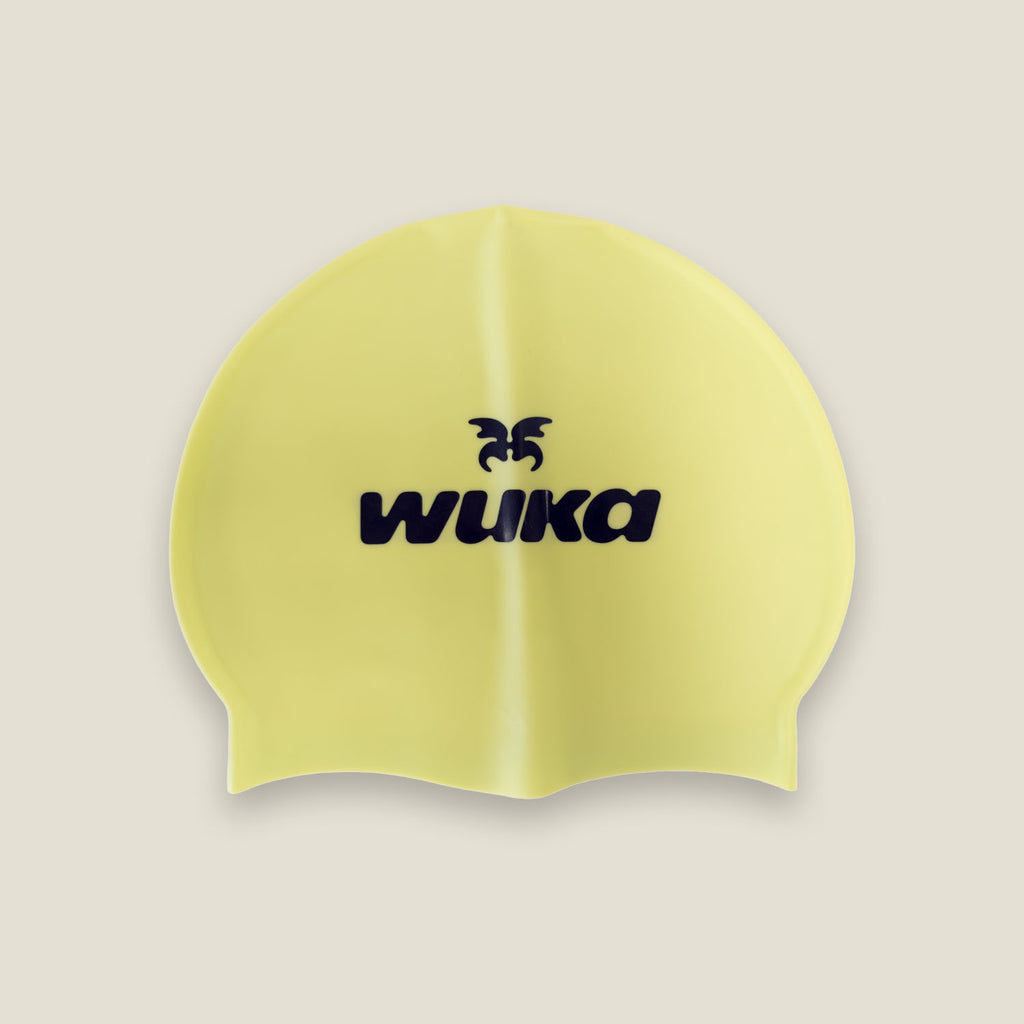 Yellow silicone swim cap with WUKA logo for women’s swimming and water sports
