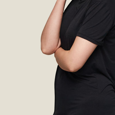 Close-up of sleeve and side seam of WUKA Jersey T-Shirt Dress, showcasing soft-touch fabric and comfort-focused stitching.