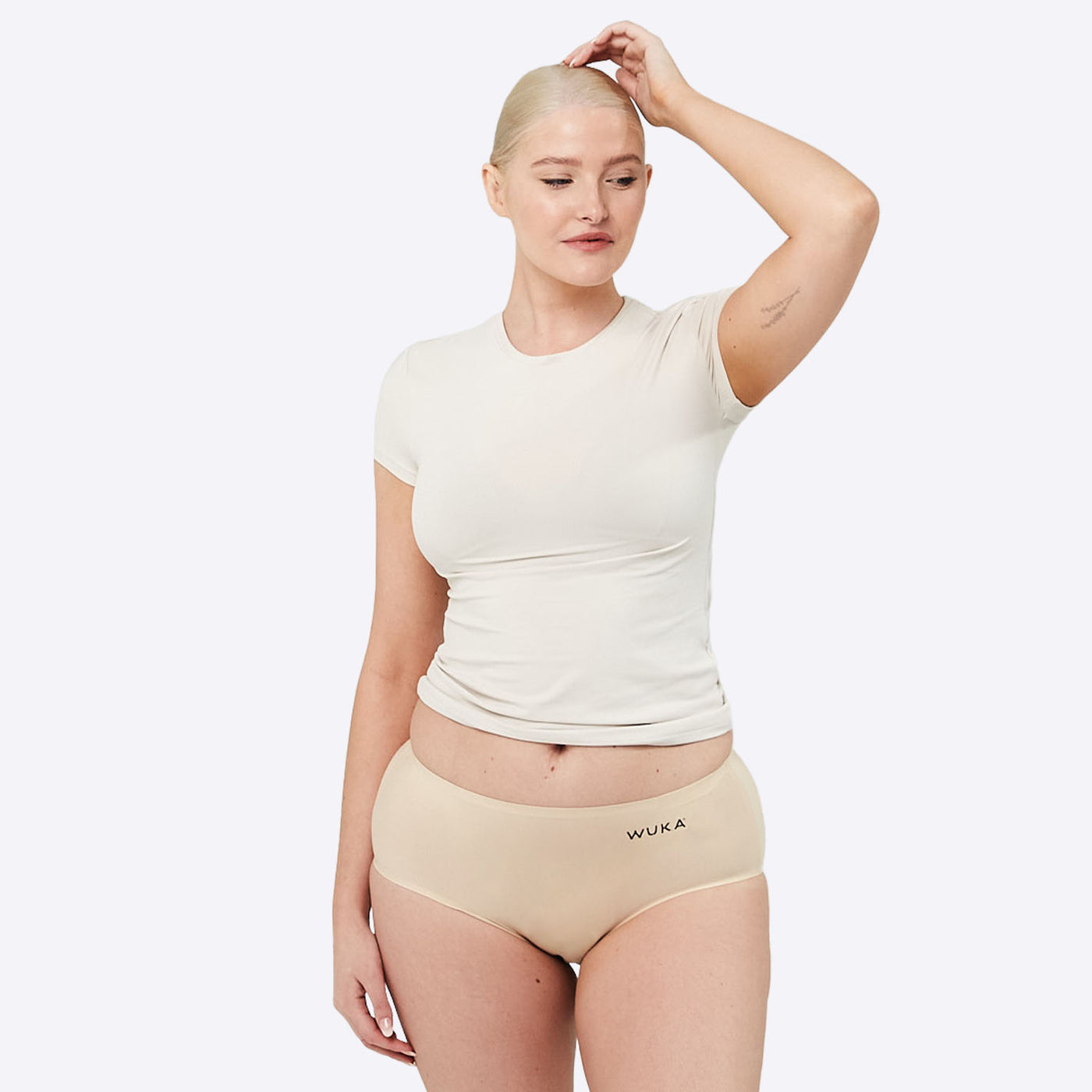 WUKA Stretch Seamless Midi Brief Style - Light  Absorbency - Light Nude - Size 2 - three quarter front